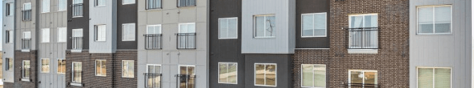 A building with a mix of brick and panel construction.